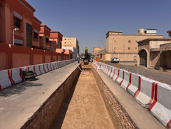 underground infrastructure site with barriers and vehicles